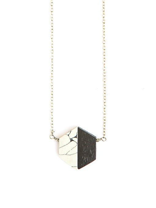 Necklace with a geometric pendant on a white background